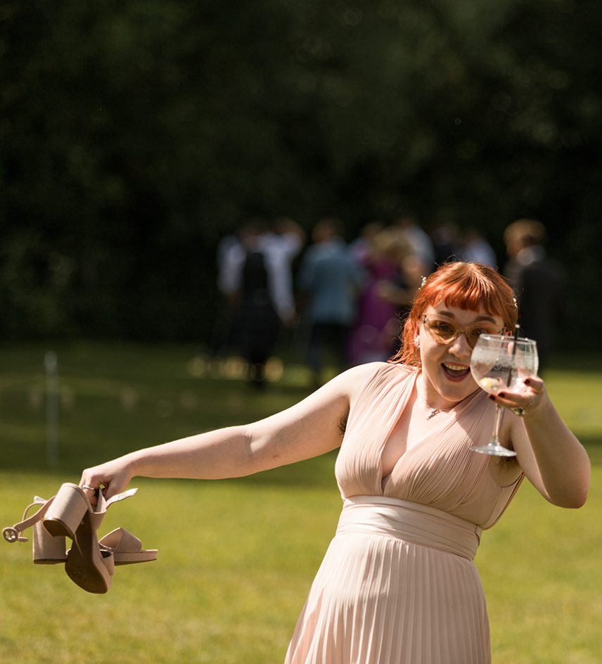bridesmaid holding drink