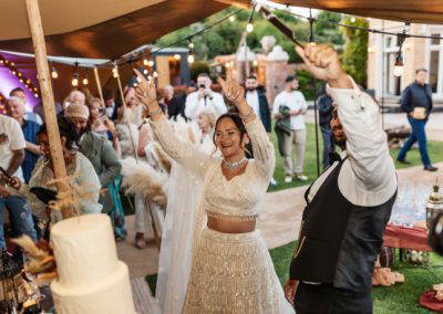 Bride and groom about to cut the wedding cake