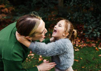 Mum and daughter laughing autumn photoshoot