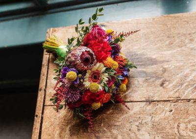 Bride's multicoloured bouquet on a table