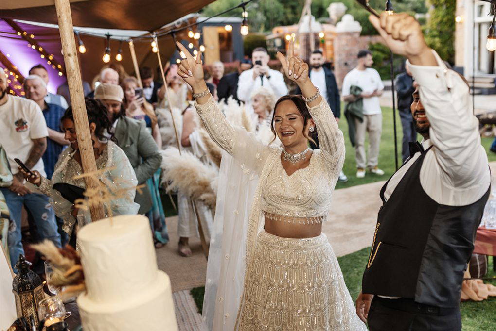 Wedding couple celebrating with friends and family