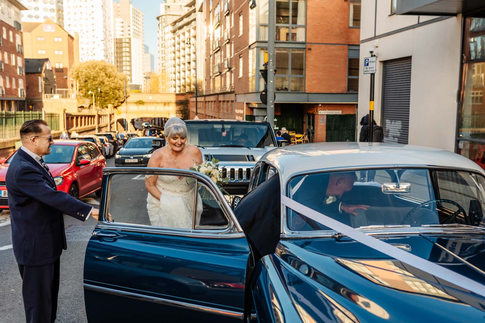 A happy couple celebrate their wedding outside Birmingham Register Office, captured in a relaxed and natural photography style.”