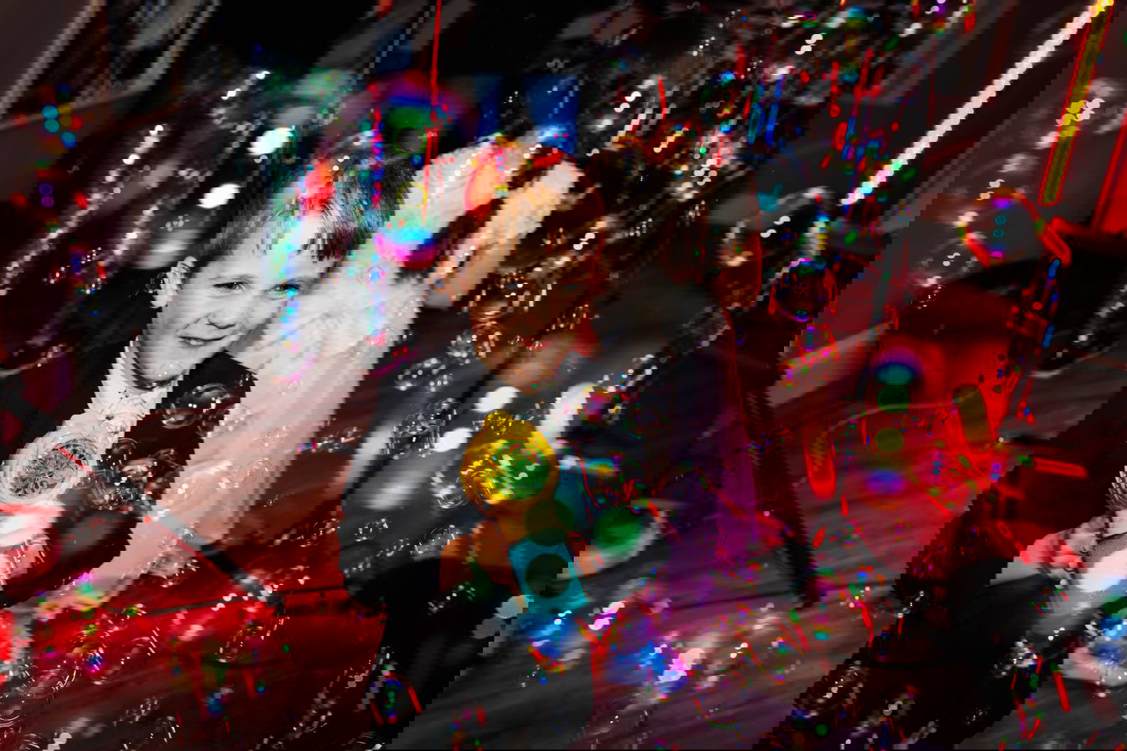 Boy with bubble gun on a wedding dance floor