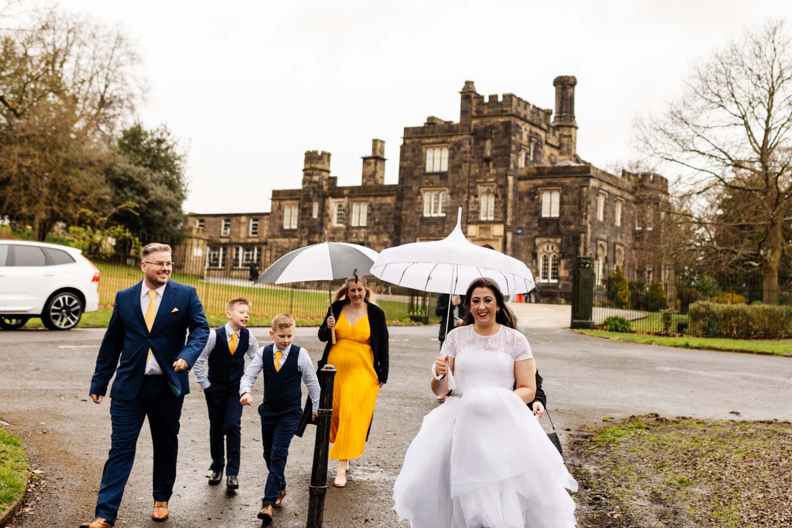Bride and family walking away from Dudley Register Office after their ceremony