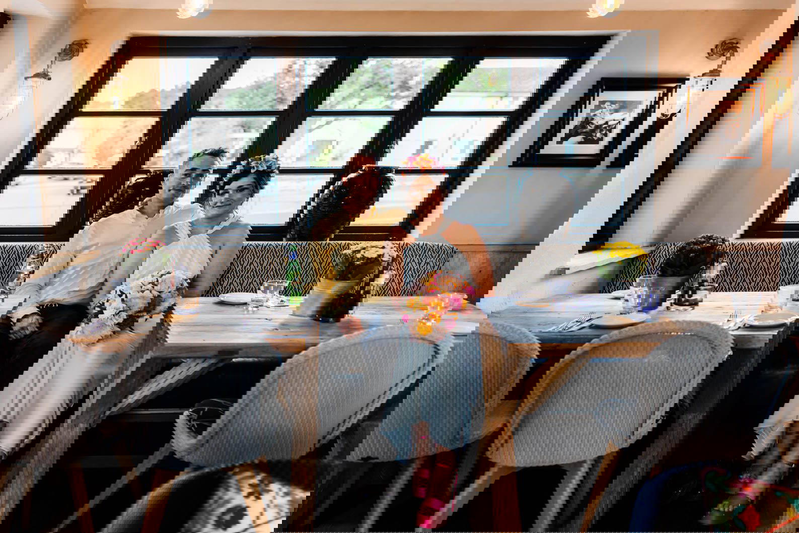 Bride and groom sharing a quiet moment inside a West Midlands wedding venue with natural window light