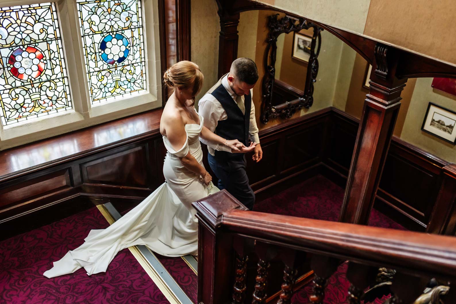 Bride and Groom in soft window light inside a Wolverhampton wedding venue during a winter wedding