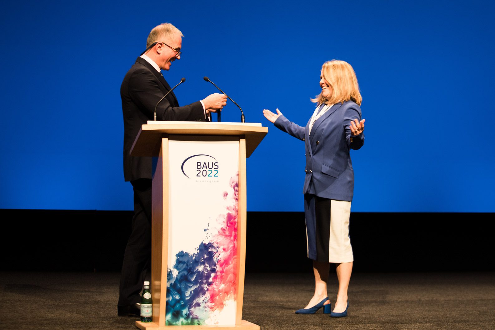 Bride and groom grinning and looking at each other
